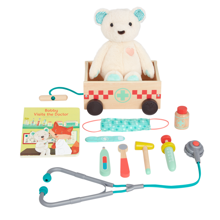 Teddy bear with book, wagon and wooden doctor tools for kids.