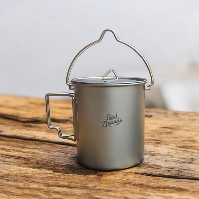 Red Beard’s Outfitter 750 mL titanium pot with lid, folding side handle, and bail handle