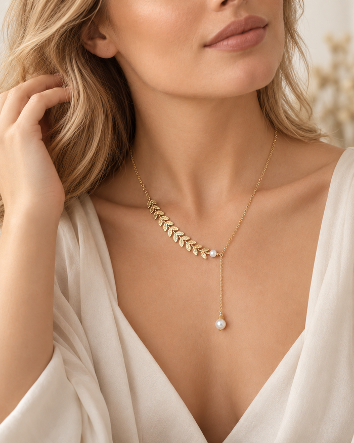 Willow + Wren gold leaf and pearl necklace worn with a white blouse